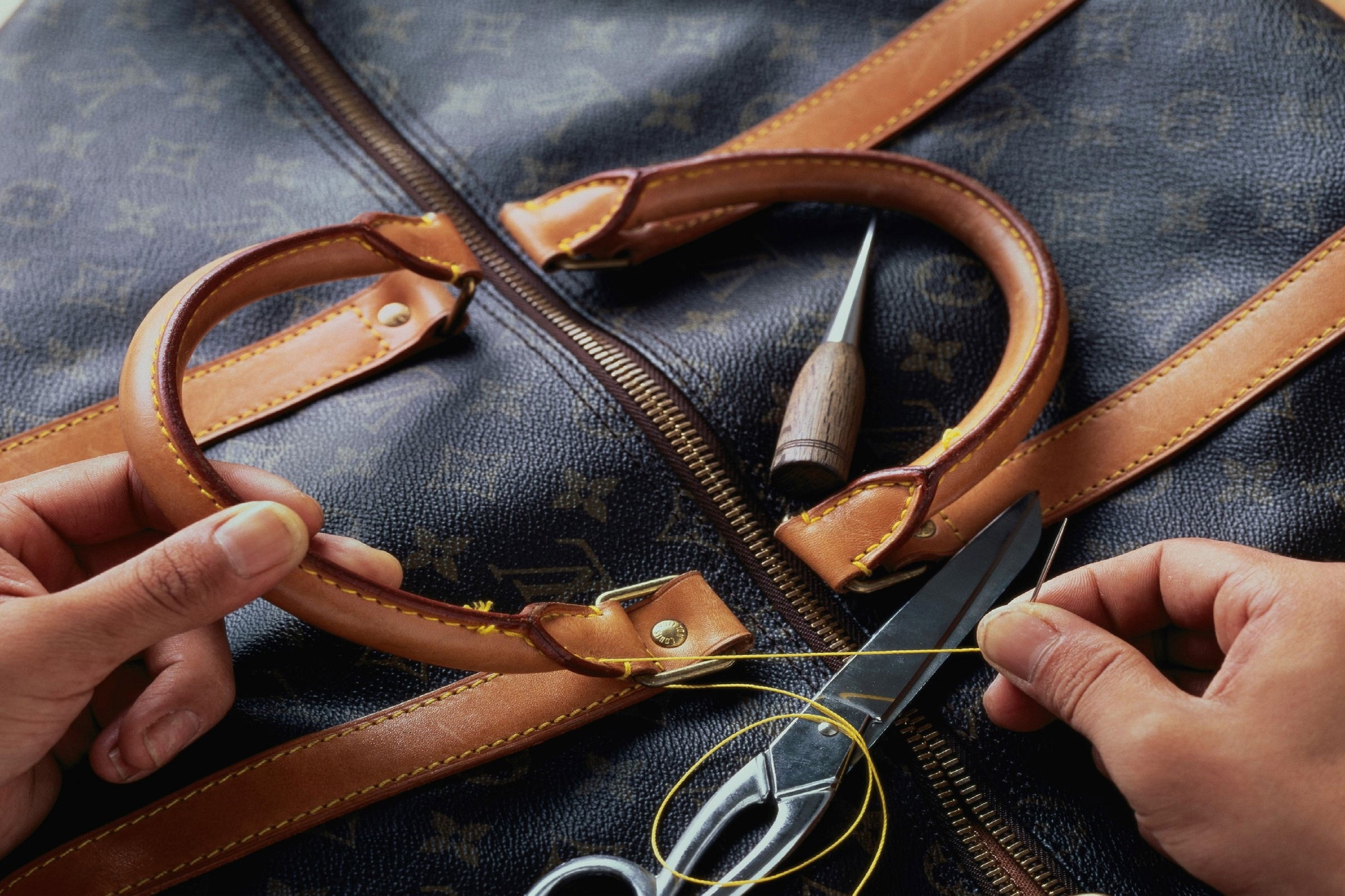 Woody's at Wellington handbags designer repair service